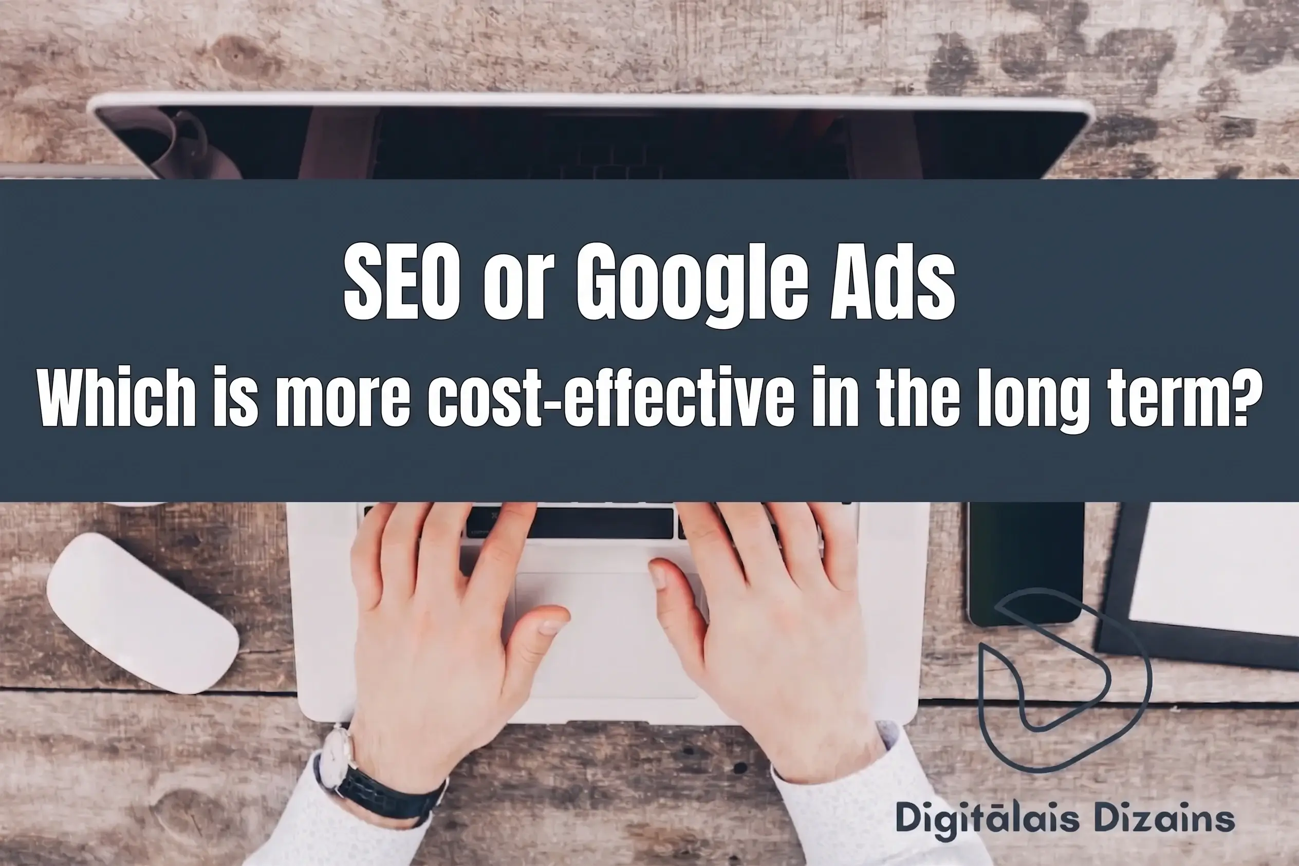 Overhead view of hands typing on a laptop with banner text "SEO vai Google Ads Kas izdevīgāks ilgtermiņā?", evaluating SEO versus paid advertising strategies.